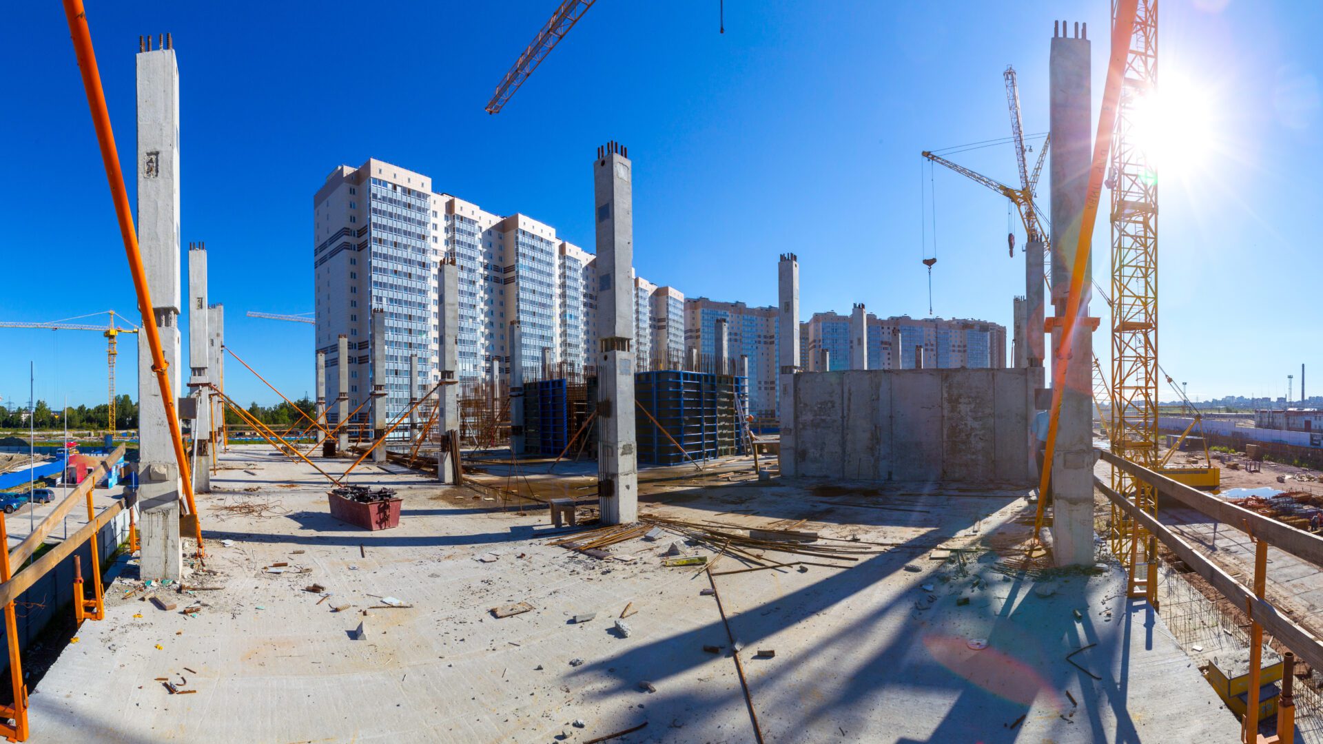 Panorama of the construction site. Construction crane. Construction of the building. Pouring cement. Formwork for pouring concrete. Fittings. Construction site with cranes and tall buildings.